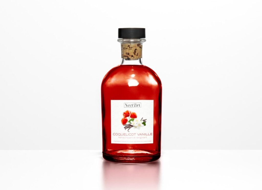 Bouteille de sirop au coquelicot et vanille. - Agence web Prism